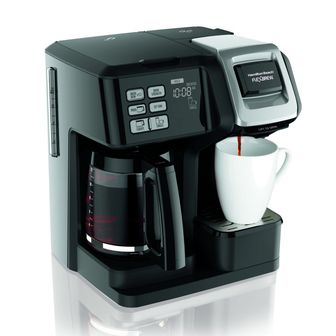 Coffeemaker pouring coffee into a mug