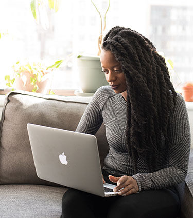 woman looking at her laptop