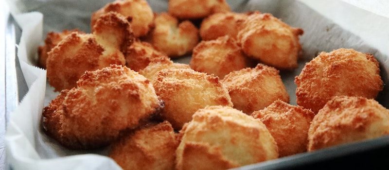 A pan filled with fried snack foods