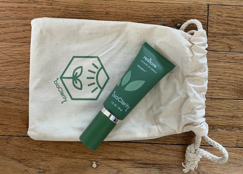 bioClarity Restore Floralux bottle on canvas pouch