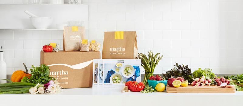 Assortment of Martha Marley Spoon boxes, cards, and ingredients