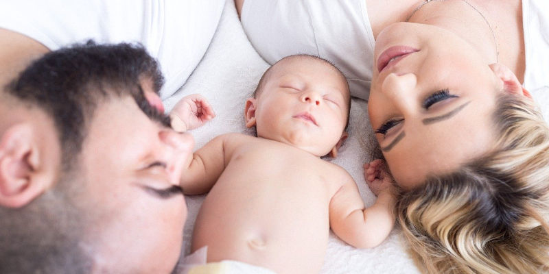 family together on bed