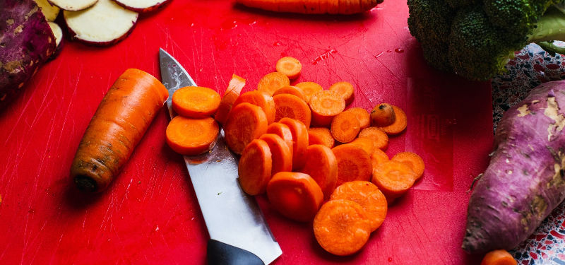 fresh veggies on a cutting board with knife