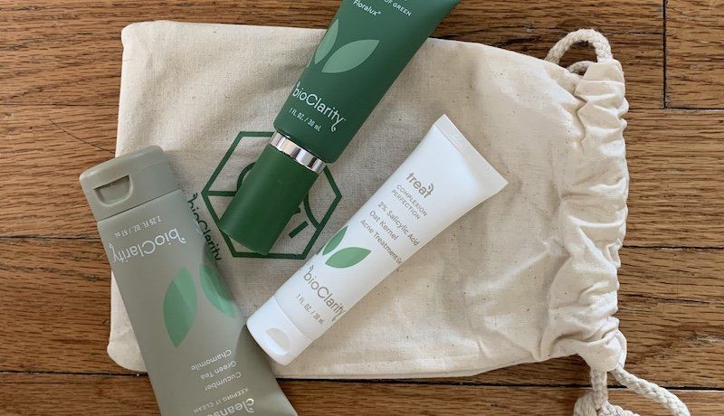 Bottles of bioClarity on bioClarity canvas pouch