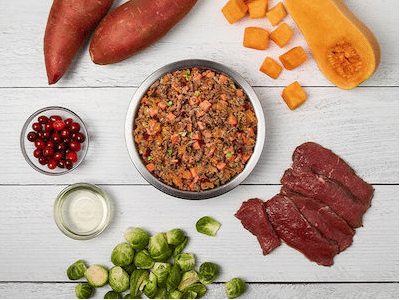 Venison and Squash recipe in bowl surrounded by ingredients