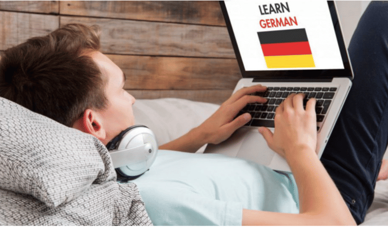 man on laptop learning german