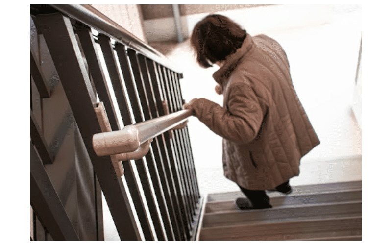 woman walking down staircase
