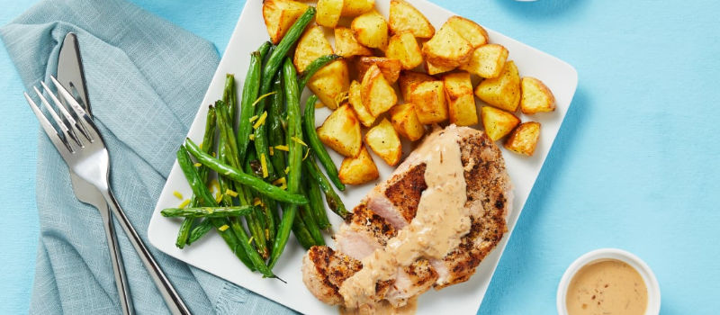 potatoes, meat, and green beans on a plate