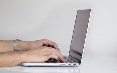 Unknown person types on computer keyboard