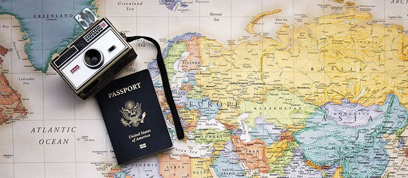 map with camera and passport