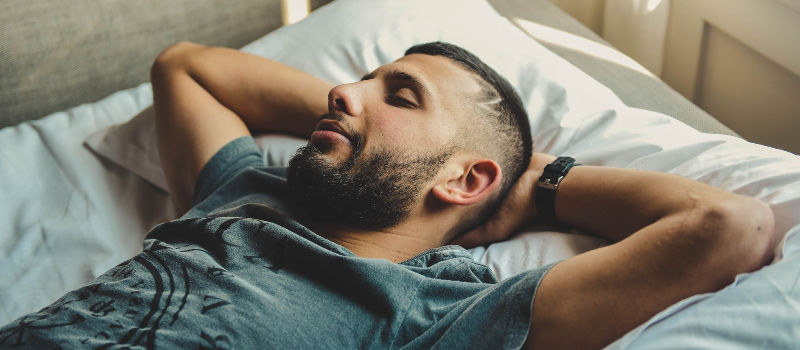 man lying on a pillow