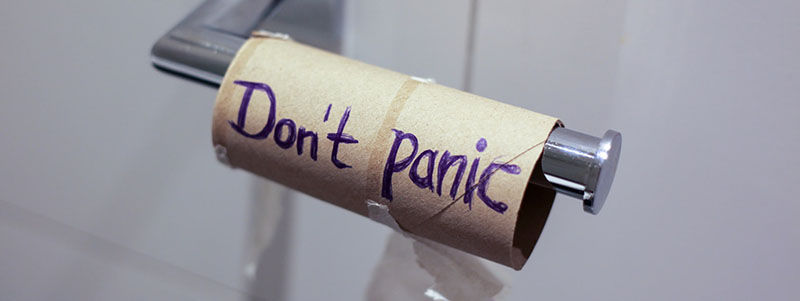 don't panic written on empty toilet paper role