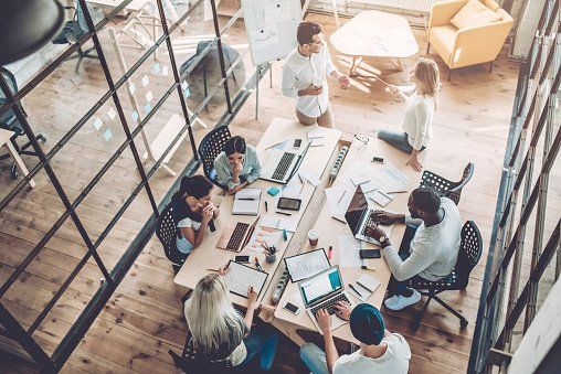 A group of people co-working at a desk