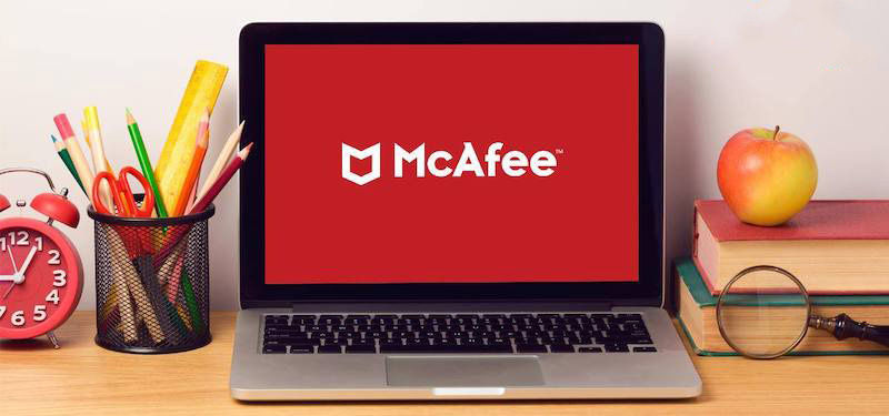 Open laptop with McAfee logo as its screensaver