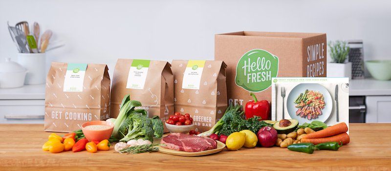 HelloFresh box and bag of recipes with ingredients and recipe card