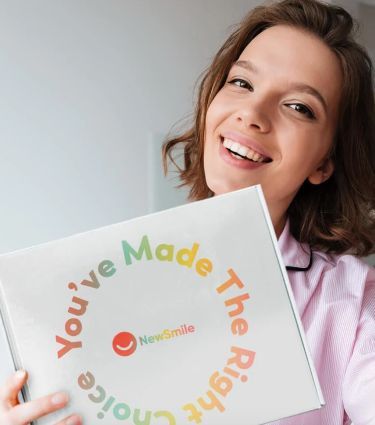 woman holding NewSmile box